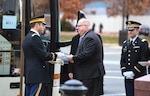 Maj. Joshua Behsudi, Mobilization Augmentation Command branch chief, hands Maryland Gov. Larry Hogan an invitation to the state funeral for 41st U.S. President George H.W. Bush prior to departing to the Washington National Cathedral Dec. 5, 2018.