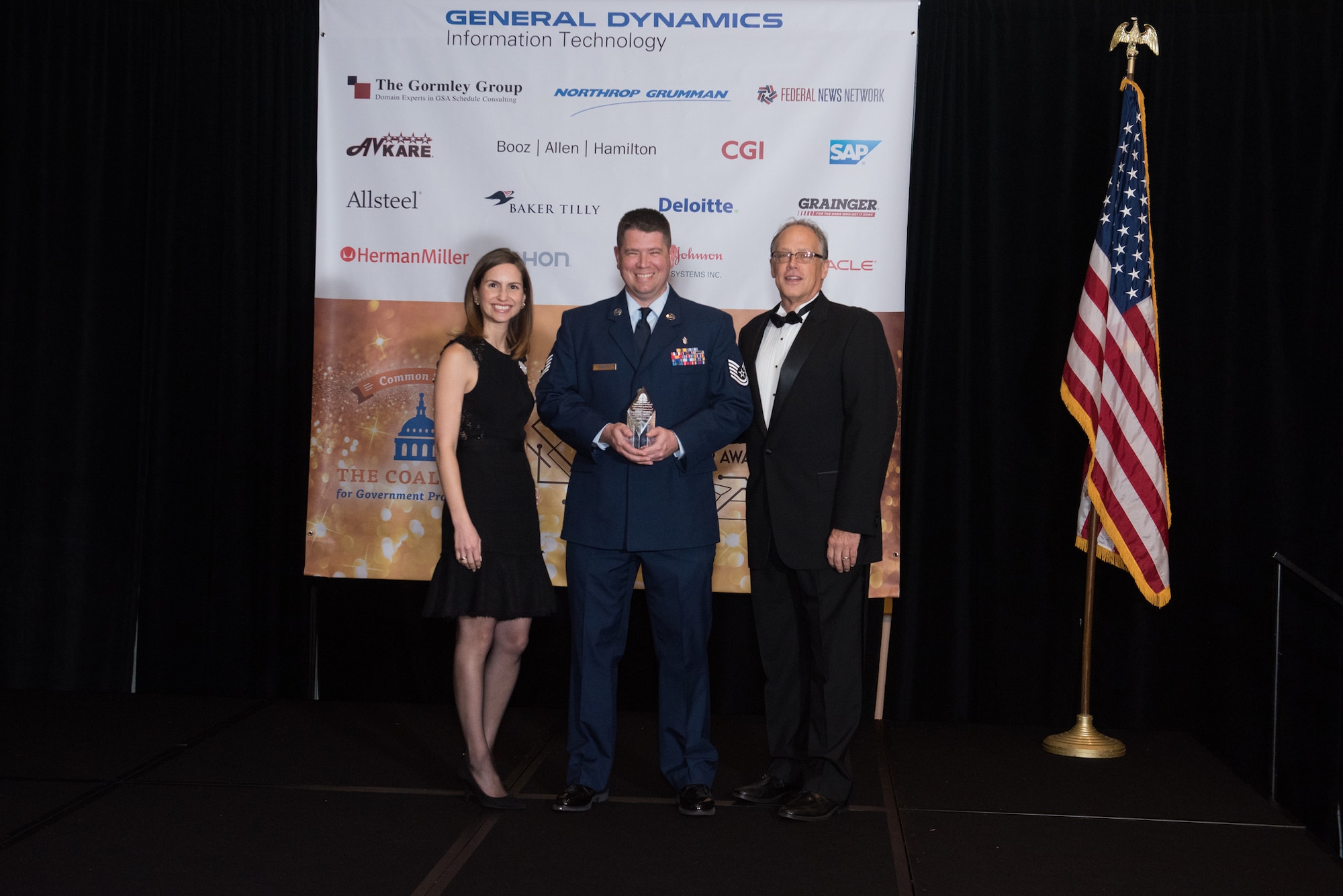 Tech. Sgt. James Sempter accepts his Excellence in Partnership Acquisitions Savings Award from the Coalition for Government Procurement on Nov. 7, 2018 in Falls Church, Va. Each year, the award is given by the Coalition for Government Procurement and is presented to one person, chosen from federal agencies like the Department of Defense, who has developed ways to save the federal government money. (Photo courtesy of Susan Hornyak)