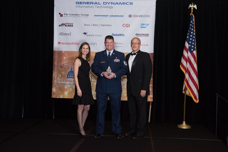 Tech. Sgt. James Sempter accepts his Excellence in Partnership Acquisitions Savings Award from the Coalition for Government Procurement on Nov. 7, 2018 in Falls Church, Va. Each year, the award is given by the Coalition for Government Procurement and is presented to one person, chosen from federal agencies like the Department of Defense, who has developed ways to save the federal government money. (Photo courtesy of Susan Hornyak)