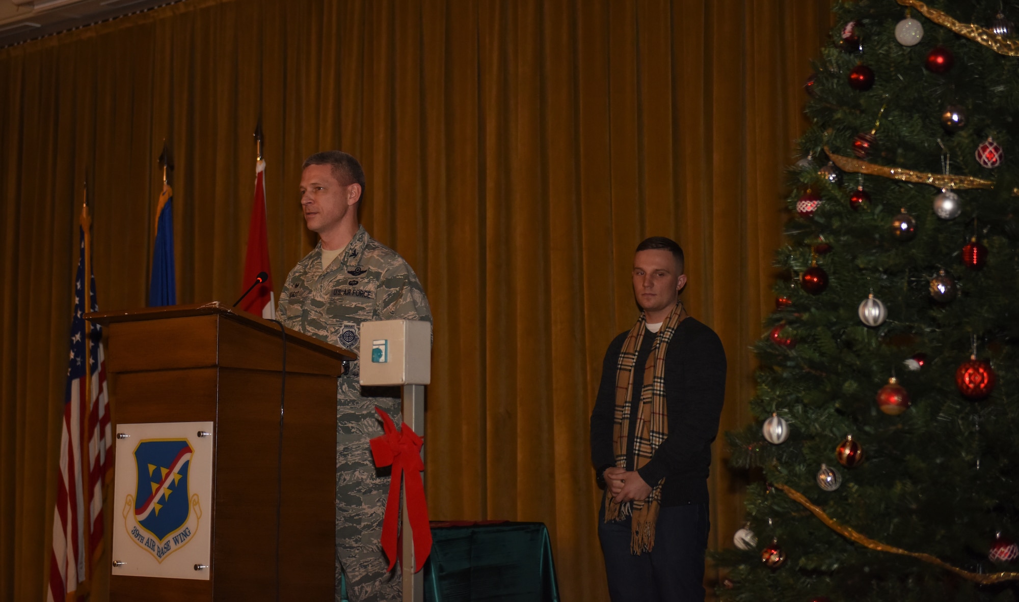 Col. Britt Hurst, 39th Air Base Wing commander, gives opening remarks during a holiday tree lighting ceremony at Incirlik Air Base, Turkey.