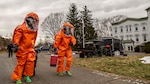 U.S. Army Staff Sgt. Kristin Northrup, a survey team chief, and Spc. Sean Murray, a survey team member, assigned to the 2nd Weapons of Mass Destruction Civil Support Team (CST), New York National Guard, move to inspect, scan and catalog the contents of a simulated bomb maker's vehicle during a hazardous materials exercise with the City of Kingston Fire Department in Kingston, N.Y., Nov. 28, 2018.