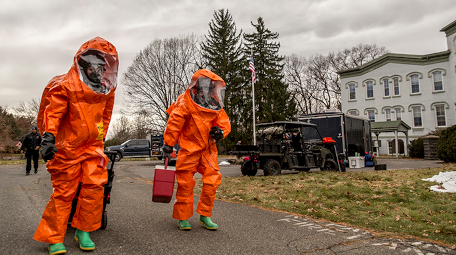 U.S. Army Staff Sgt. Kristin Northrup, a survey team chief, and Spc. Sean Murray, a survey team member, assigned to the 2nd Weapons of Mass Destruction Civil Support Team (CST), New York National Guard, move to inspect, scan and catalog the contents of a simulated bomb maker's vehicle during a hazardous materials exercise with the City of Kingston Fire Department in Kingston, N.Y., Nov. 28, 2018.