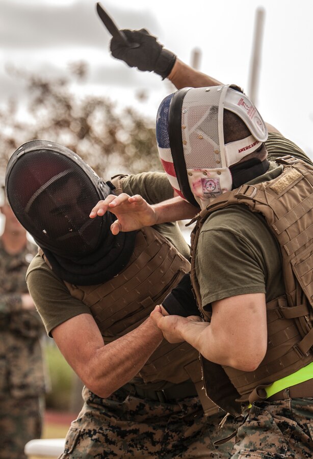 Marines with Marine Corps Support Facility New Orleans compete in the knife fighting portion of the Marine Forces Reserve King of the Ring tournament, Nov. 30, 2018. Competitors demonstrate their knowledge of various Marine Corps mixed martial art techniques during the tournament involving knife fighting, grappling and baton fighting. (U.S. Marine Corps photo by Sgt. Dante J. Fries)