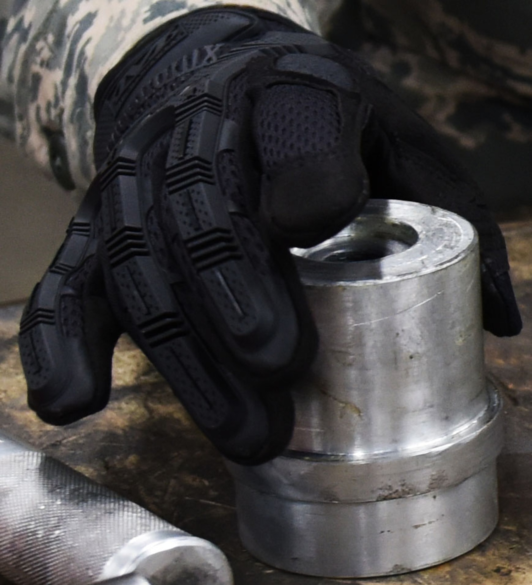 U.S. Air Force Airman 1st Class Sondra Saul, 20th Equipment Maintenance Squadron aircraft metals technician apprentice, reaches for a new bearing cup to replace it, at Shaw Air Force Base, Nov. 30, 2018.