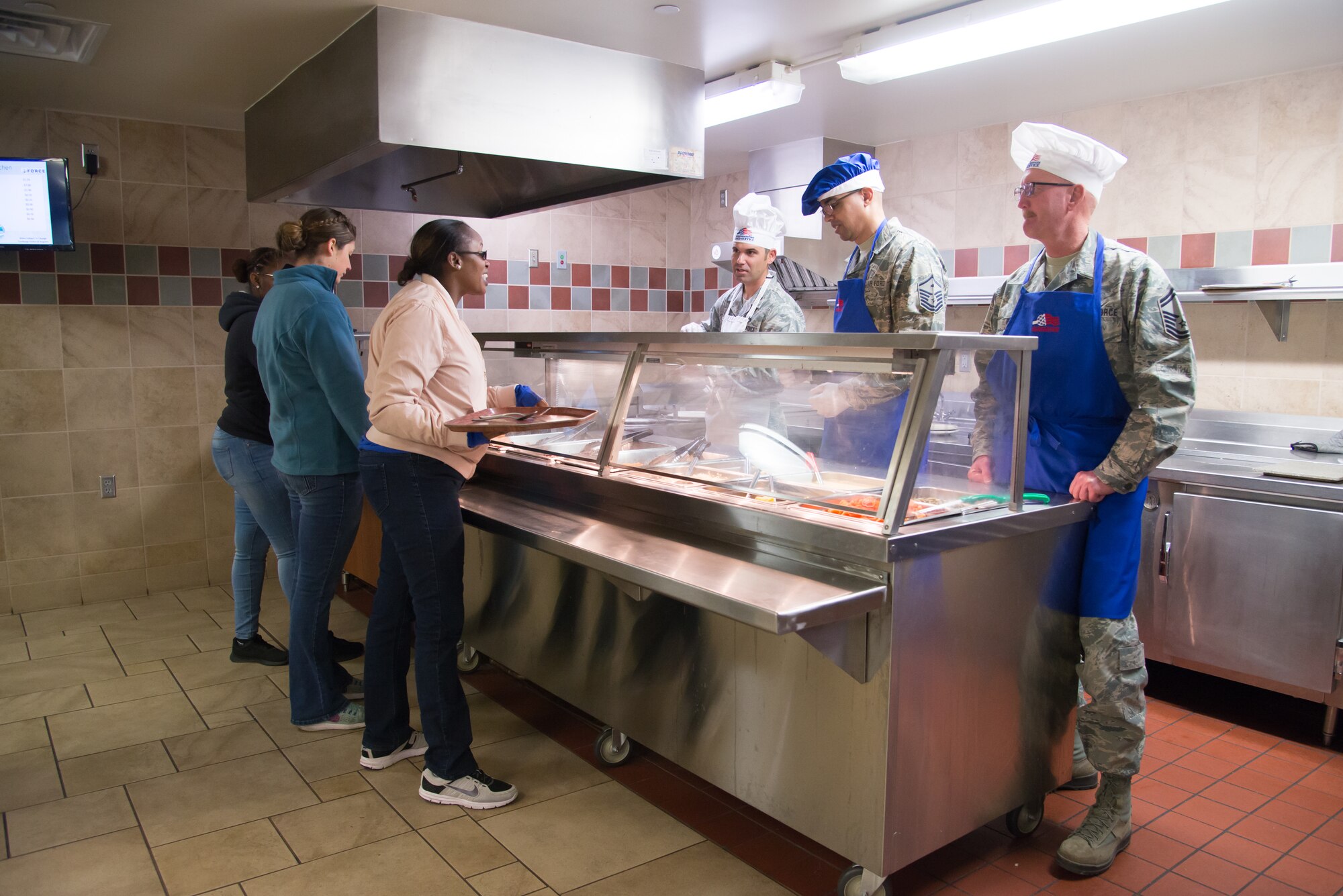 Leaders from the 302nd Airlift Wing serve lunch at the Argon dining facility during the monthly unit training assembly Dec. 1, 2018 at Peterson Air Force Base, Colorado.