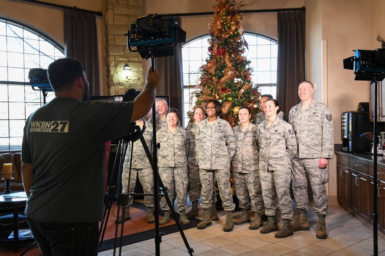 Reserve Citizen Airmen of the 910th Force Support Squadron record a holiday greeting with a local news station to be released near Christsmas in the Eagle’s Nest Lodge at the Youngstown Air Reserve Station, Dec. 2. 2018.