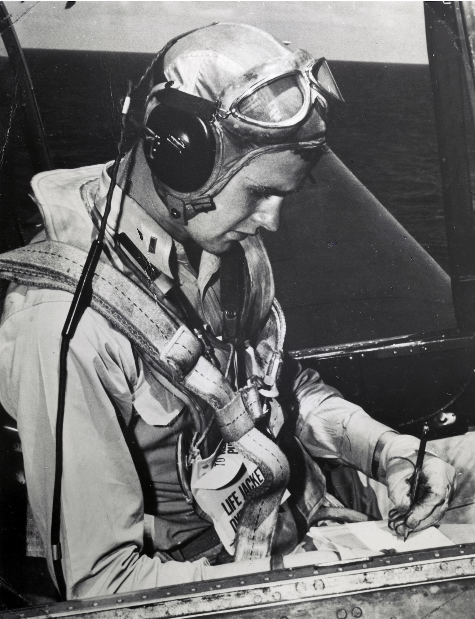 A file photo taken in 1944 of Navy pilot George H. W. Bush in the cockpit of his Grumman TBF Avenger torpedo bomber.