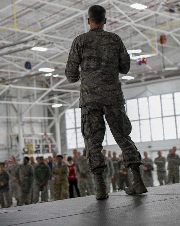 Col. Dan Sarachene, 910th Airlift Wing commander, speaks to 910th Airlift Wing members during the holiday commander’s call in Hangar 305 at Youngstown Reserve Station, Dec. 1, 2018.