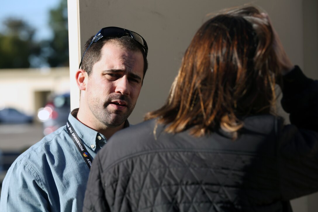 Mick Wasco, Marine Corps Air Station Miramar installations energy manager, speaks with members of the California Public Utilities Commission during a tour highlighting the stations innovative energy projects at MCAS Miramar, Calif., Dec. 3. The members of the California Public Utilities Commision toured MCAS Miramar’s energy operations center, the micro grid, current energy conservation projects, the flight line and the Miramar landfill, which provides renewable power for the base. (U.S. Marine Corps photo by Sgt. Jake McClung)