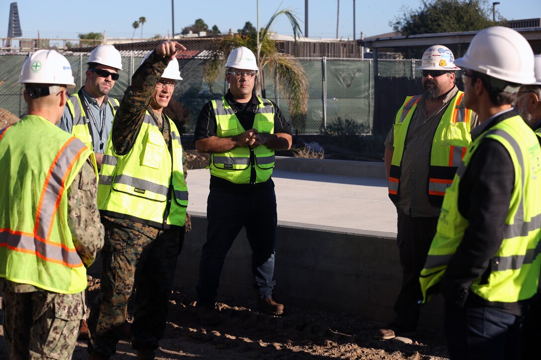 Col. Charles Dockery, commanding officer of Marine Corps Air Station Miramar, shows members of the California Public Utilities Commision current projects that are taking place on base during a tour highlighting the stations innovative energy projects at MCAS Miramar, Calif., Dec. 3. The members of the California Public Utilities Commision toured MCAS Miramar’s energy operations center, the micro grid, current energy conservation projects, the flight line and the Miramar landfill, which provides renewable power for the base. (U.S. Marine Corps photo by Sgt. Jake McClung)