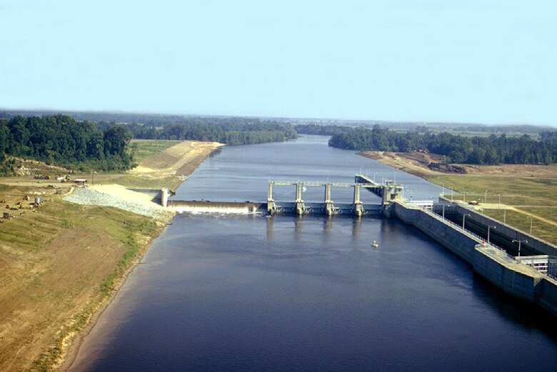 VICKSBURG, Miss. – Elevated water levels on the Ouachita River have delayed the U.S. Army Corps of Engineers (USACE) Vicksburg District’s emergency repair work at Columbia Lock and Dam, located approximately seven miles upstream of Columbia, Louisiana. 

Due to unusually severe rain events in February 2019, river stages have been at or slightly above the top of the lock’s walls. Up until this week, the Vicksburg District and Massman Construction Co. have successfully used alternative construction methods to mitigate impacts from the high river stages and avoid suspension of repair work at the site. Massman Construction Co. modified its working platforms to allow repair work to continue despite the higher-than-normal river stages on the Ouachita River. Recent rainfall has now caused river stages to overtop the lock’s walls by over two feet, flooding the site and stopping work. River stages are currently continuing on a flat to slow rise with additional rain in the forecast.

The current pool at Columbia Lock and Dam is 13 feet higher than normal pool stage.
