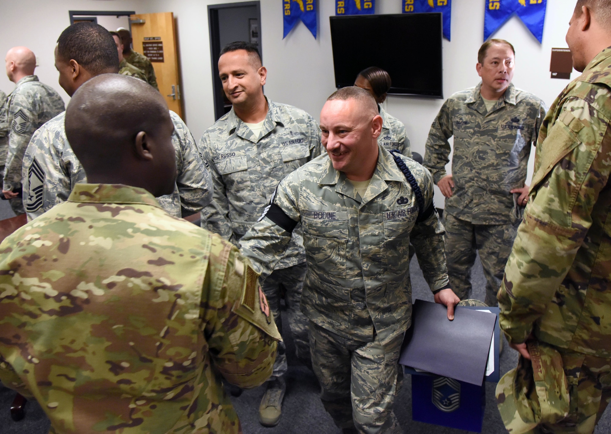 U.S. Air Force Senior Master Sgt. Andrew Bodine, 81st Training Group Military Training superintendent, is congratulated upon the notification of his promotion to the rank of chief master sergeant at Keesler Air Force Base, Mississippi, Dec. 4, 2018. Five senior master sgts. were notified and congratulated for their promotion by the base's leadership and chiefs. (U.S. Air Force photo by Kemberly Groue)