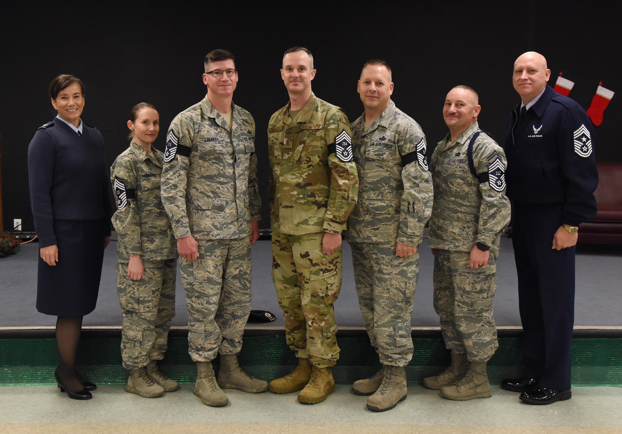 U.S. Air Force Col. Debra Lovette, 81st Training Wing commander, and Chief Master Sgt. David Pizzuto, 81st TRW command chief, pose for a photo with Keesler�s newest chief master sergeant selects at Keesler Air Force Base, Mississippi, Dec. 4, 2018. Senior Master Sgts. Katie Hammonds, 81st Medical Support Squadron medical logistics flight chief; Kevin Lambert, 81st Security Forces Squadron operations superintendent; Charles Sargent, 338th Training Squadron flight chief; Michael Sterling, 81st Communications Squadron superintendent, and Andrew Bodine, 81st Training Group Military Training superintendent, were notified of their selection to the rank of chief master sergeant by base leadership and chiefs. (U.S. Air Force photo by Kemberly Groue)