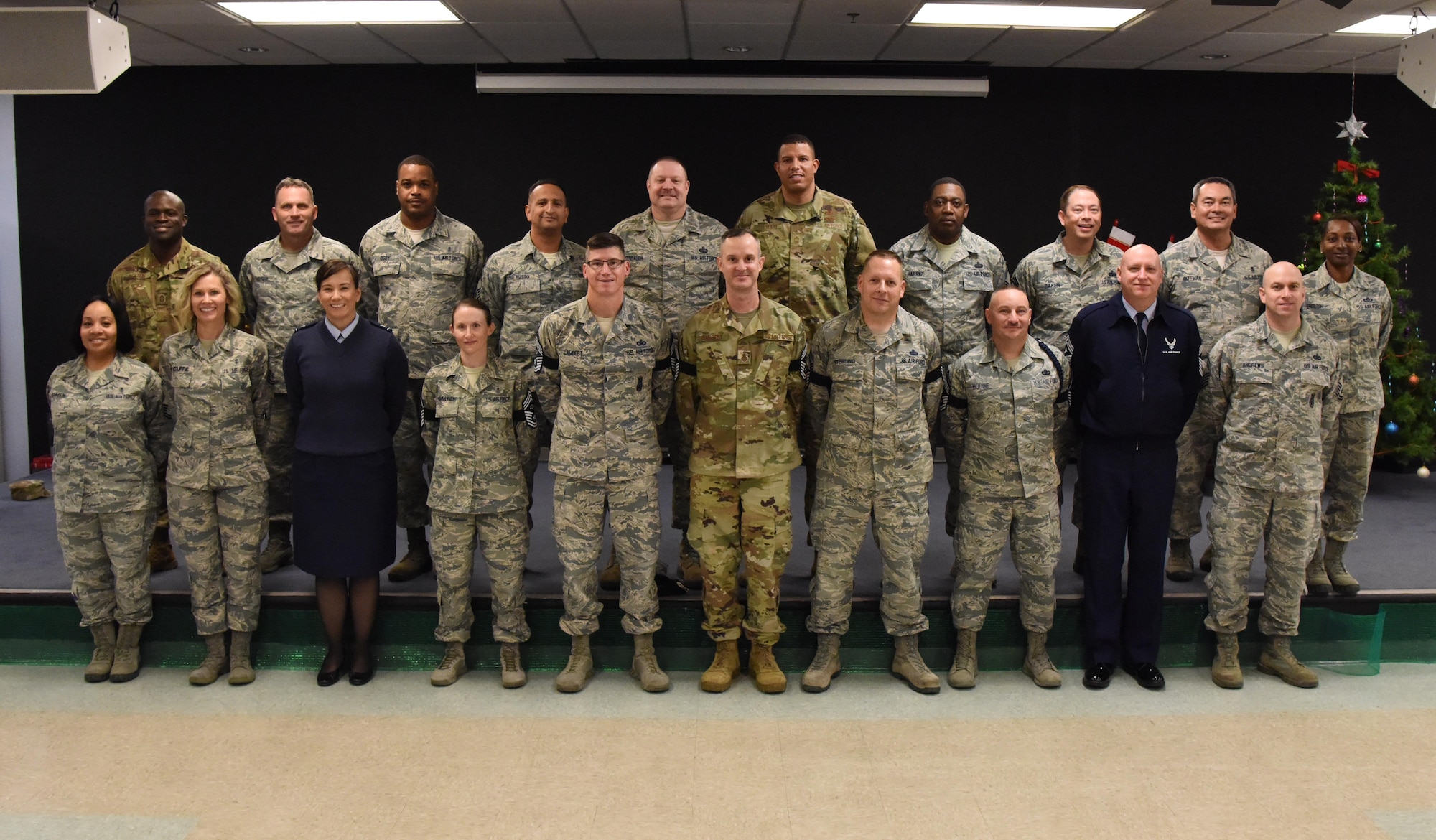 U.S. Air Force Col. Debra Lovette, 81st Training Wing commander, and Chief Master Sgt. David Pizzuto, 81st TRW command chief, pose for a photo with Keesler's newest chief master sergeant selects at Keesler Air Force Base, Mississippi, Dec. 4, 2018. Senior Master Sgts. Katie Hammonds, 81st Medical Support Squadron medical logistics flight chief; Kevin Lambert, 81st Security Forces Squadron operations superintendent; Charles Sargent, 338th Training Squadron flight chief; Michael Sterling, 81st Communications Squadron superintendent, and Andrew Bodine, 81st Training Group Military Training superintendent, were notified of their selection to the rank of chief master sergeant by base leadership and chiefs. (U.S. Air Force photo by Kemberly Groue)