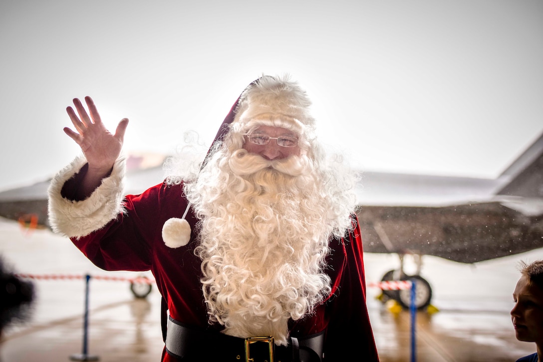 Santa Claus greets 419th Fighter Wing Airmen and their families during the 419th Fighter Wing’s annual holiday party