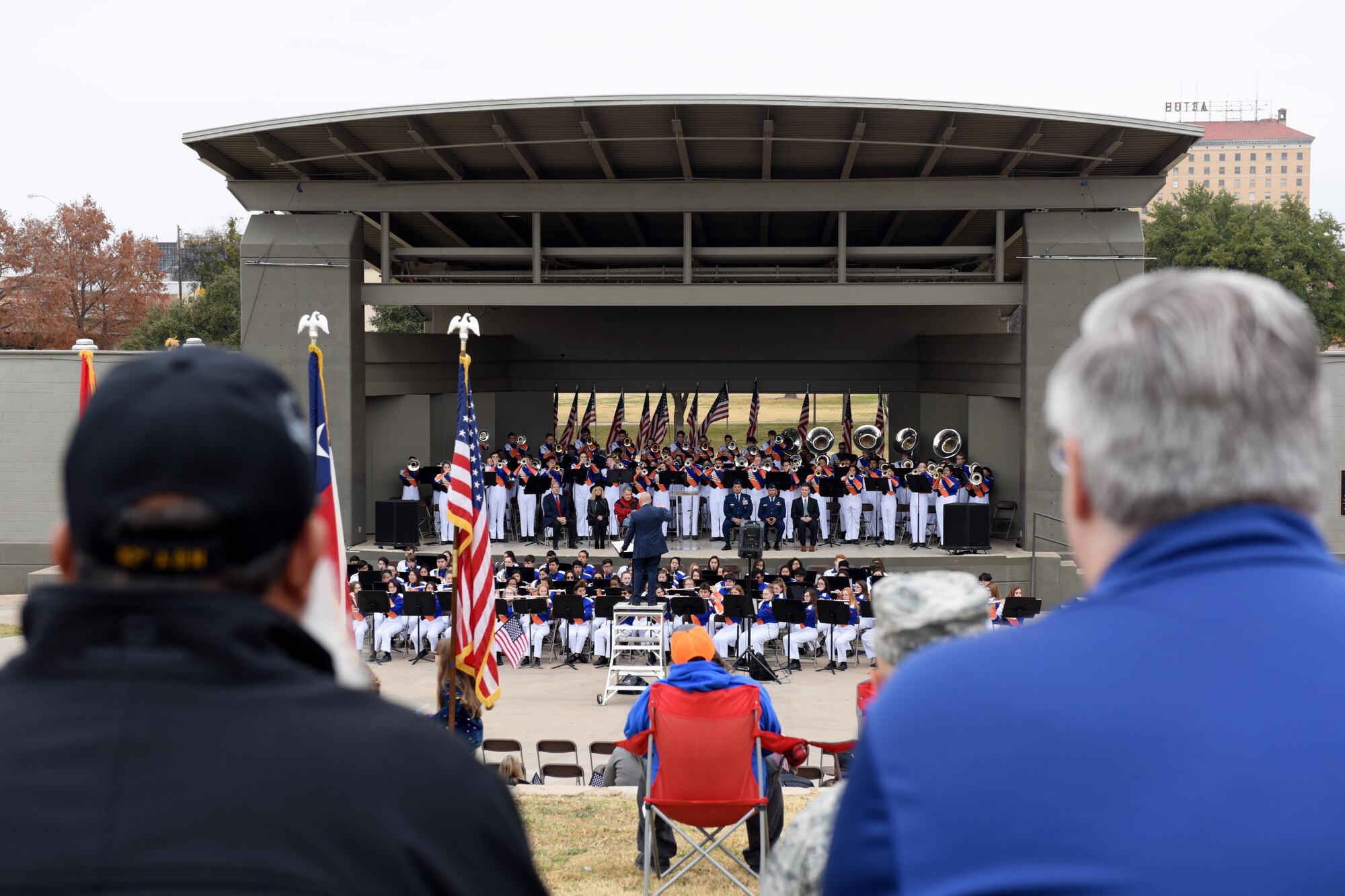 Spectators watch the Central High School Band during the Hero’s Hunt Honor Concert at the Bill Aylor Sr. Memorial RiverStage in San Angelo, Texas, Dec. 6, 2018. The Hero’s Hunt Honor Concert honors wounded veterans with speeches from local leaders, music by the Central High School Band and recognition from members of San Angelo. (U.S. Air Force photo by Senior Airman Randall Moose/Released)