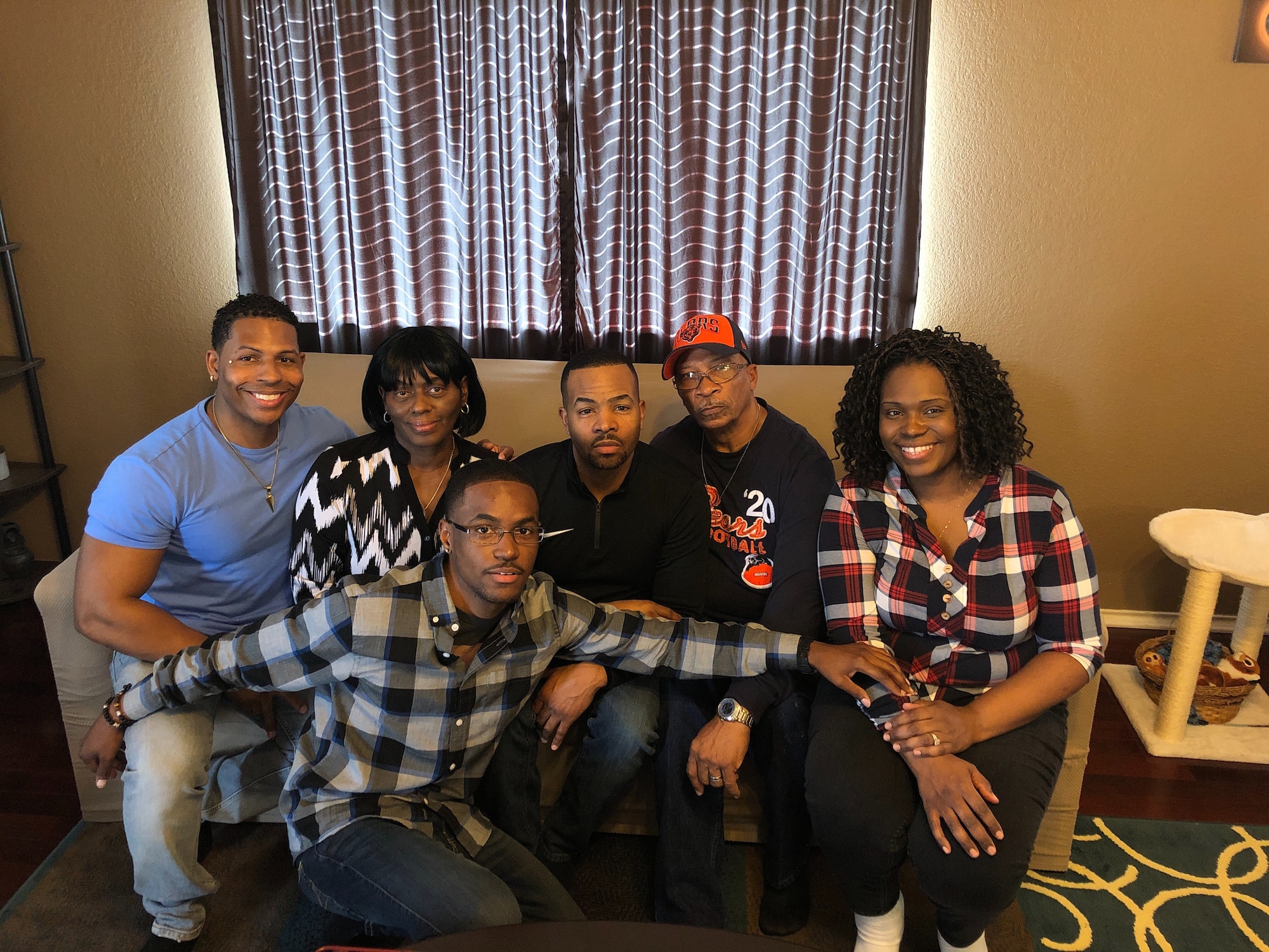 Airman 1st Class Jermaine Ayers, 15th Wing broadcaster, poses for a photo with his family members, in Killeen, Texas, Nov. 22, 2018. Ayers was selected by the Operation Ride Home program to receive funding that helped him reunite with his family during the holidays. (U.S. Air Force photo by Airman 1st Class Jermaine Ayers)