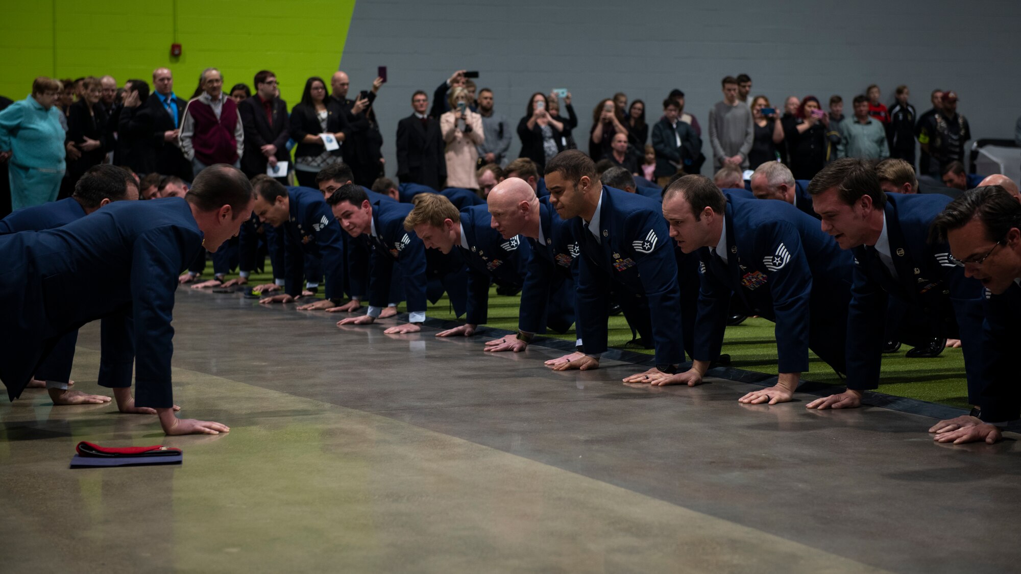 Airmen and family members perform memorial pushups in honor of U.S. Air Force Staff Sgt. Dylan Elchin, a Special Tactics combat controller with the 26th Special Tactics Squadron, during a memorial service in Moon Township, Pennsylvania, Dec. 6, 2018.