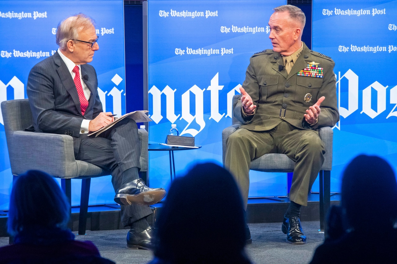 Marine Corps Gen. Joe Dunford talks to a moderator during a panel discussion.