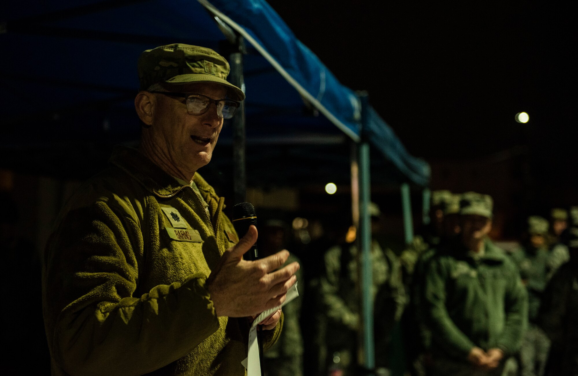 U.S. Air Force Lt. Col. David Barnes, 8th Fighter Wing chaplain, says an opening prayer for a tree lighting ceremony at Kunsan Air Base, Republic of Korea, Nov. 29, 2018. The 8th FW chapel hosted an event for the Wolf Pack and Republic of Korea Air Force’s 38th Fighter Group to kick off the holiday season. (U.S. Air Force photo by Senior Airman Stefan Alvarez)