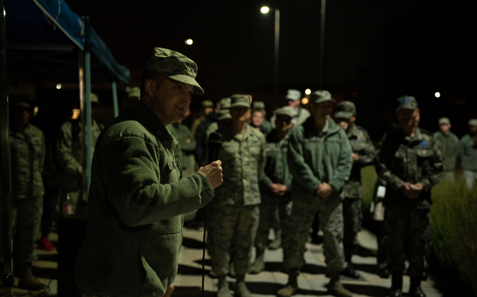 U.S. Air Force Col. John Bosone, 8th Fighter Wing commander, gives opening remarks for a tree lighting ceremony at Kunsan Air Base, Republic of Korea, Nov. 29, 2018. Kunsan celebrated the start of the holiday season with a base-wide event held by the 8th FW chapel. (U.S. Air Force photo by Senior Airman Stefan Alvarez)