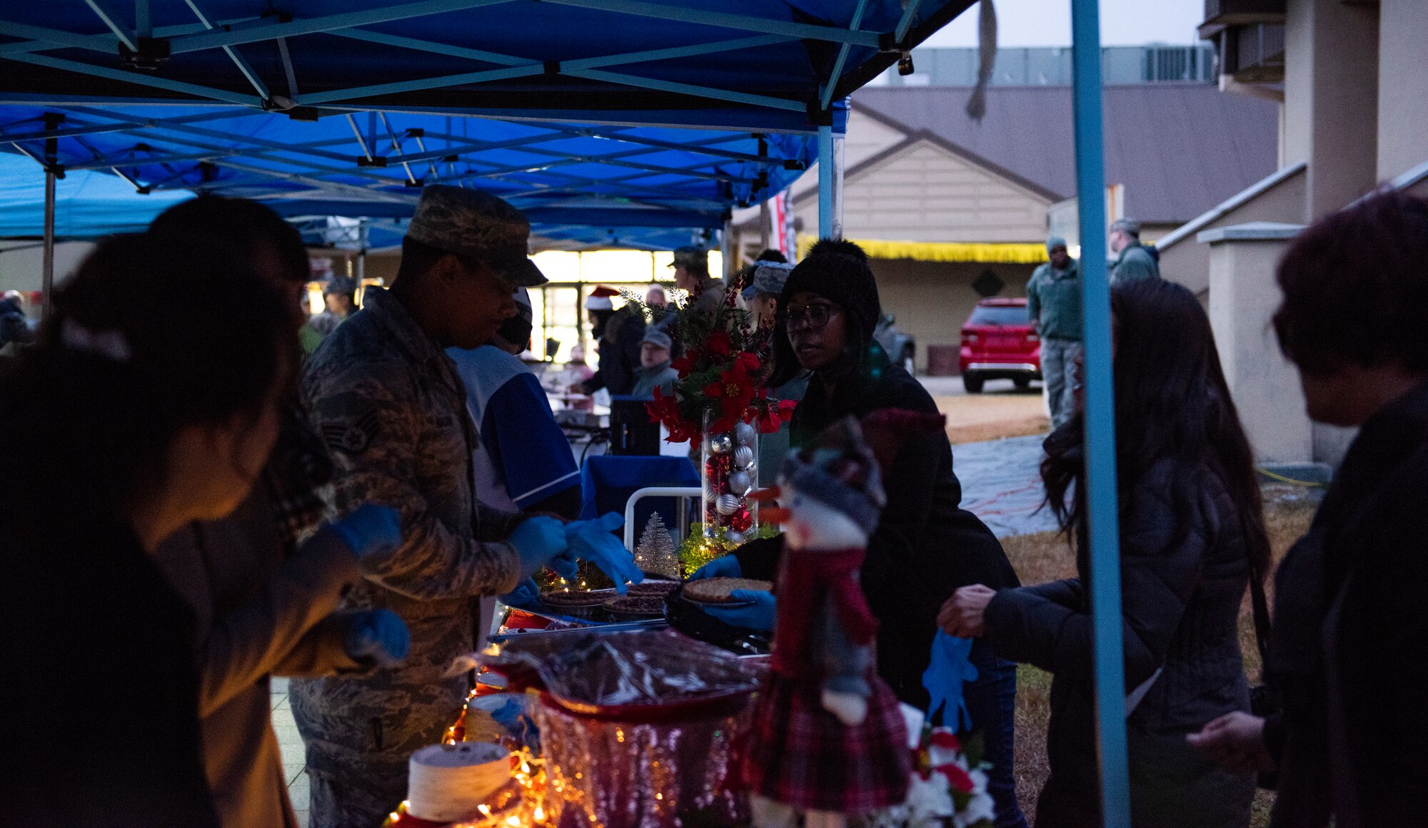 Members of the 8th Fighter Wing set up snacks for a tree lighting ceremony at Kunsan Air Base, Republic of Korea, Nov. 29, 2018. The 8th FW chapel hosted a small event for the Wolf Pack and the Republic of Korea Air Force’s 38th Fighter Group to kick off the holiday season. (U.S. Air Force photo by Senior Airman Stefan Alvarez)