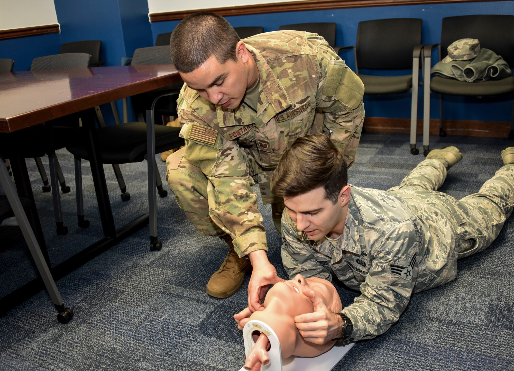 U.S. Air Force Tech. Sgt. Jerediah Fontanos, 70th Intelligence, Surveillance and Reconnaissance Wing Operational Medical technician, demonstrates how to perform a head-tilt, jaw-thrust maneuver during a Self-Aid and Buddy Care training session at Fort George G. Meade, Maryland, Dec. 4, 2018. (U.S. Air Force photo by Staff Sgt. AJ Hyatt)