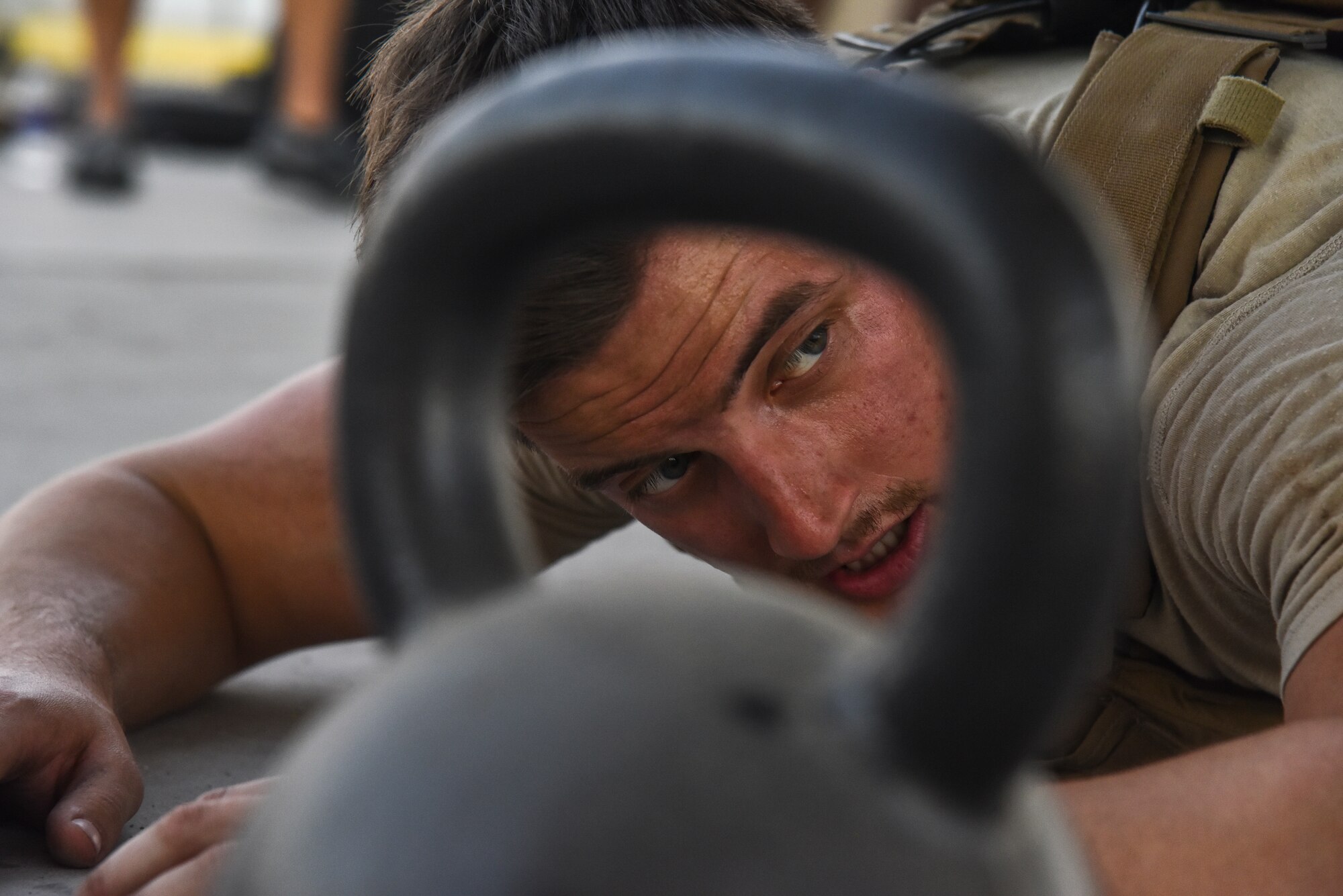 A U.S. Air Force Airman takes a rest during the EOD 134 Memorial Workout at Al Dhafra Air Base, United Arab Emirates, Nov. 30, 2018. 380th Air Expeditionary Wing Airmen, along with coalition partners, participated in the workout to honor the 134 EOD technicians from the U.S. Air Force, Army, Navy and Marine Corps that have been killed since Sept. 11, 2001. (U.S. Air Force photo by Senior Airman Mya M. Crosby)
