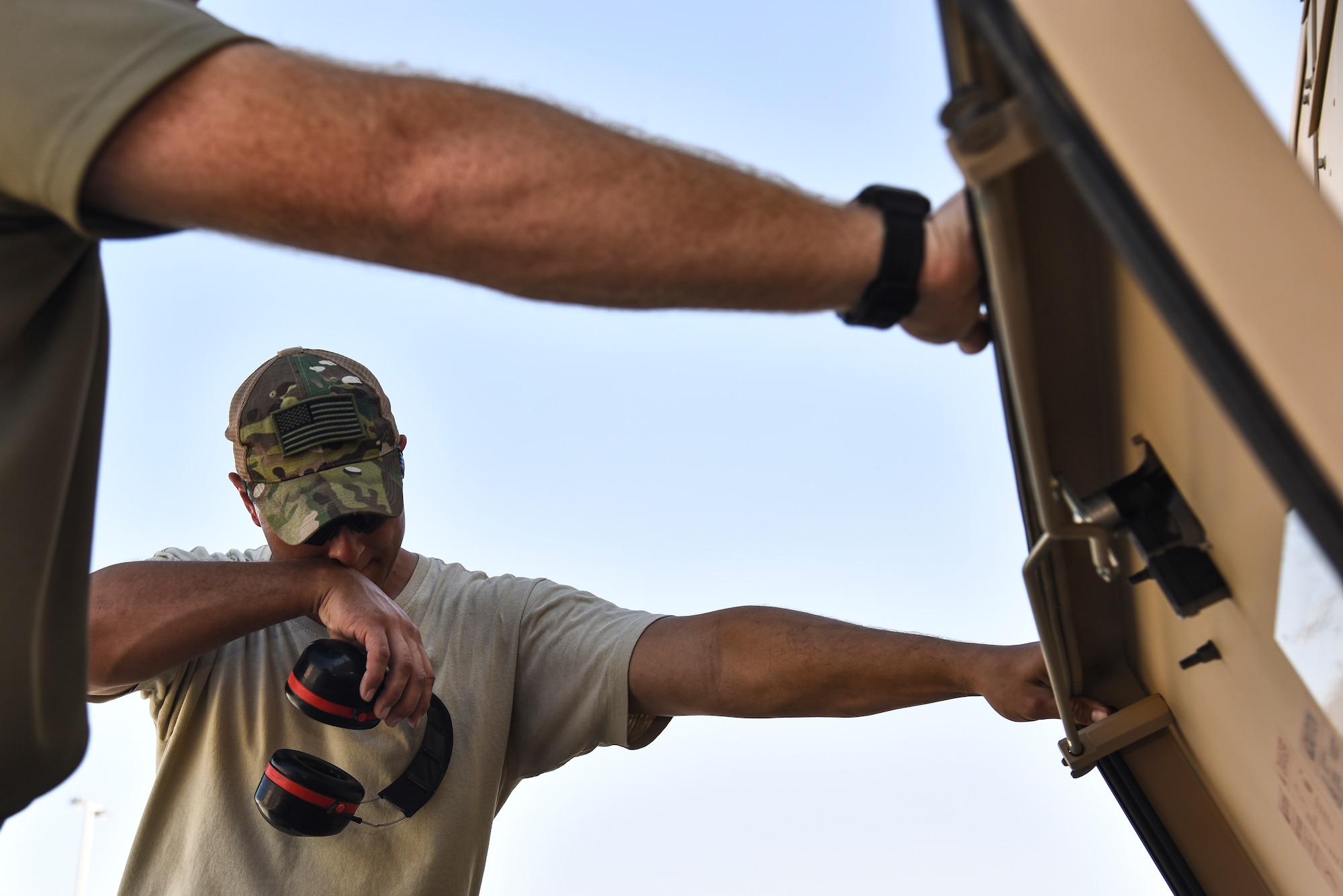 U.S. Air Force Staff Sgt. Shaun Kelly, 380th Expeditionary Civil Engineer Squadron electrical power production craftsman, performs a daily inspection on a generator at Al Dhafra Air Base, United Arab Emirates, Nov. 19, 2018. The Power Production flight provides two main capabilities: maintaining power generators for buildings across the installation, and ensuring the integrity of the fighter aircraft arresting barrier systems on the flight line. (U.S. Air Force photo by Senior Airman Mya M. Crosby)