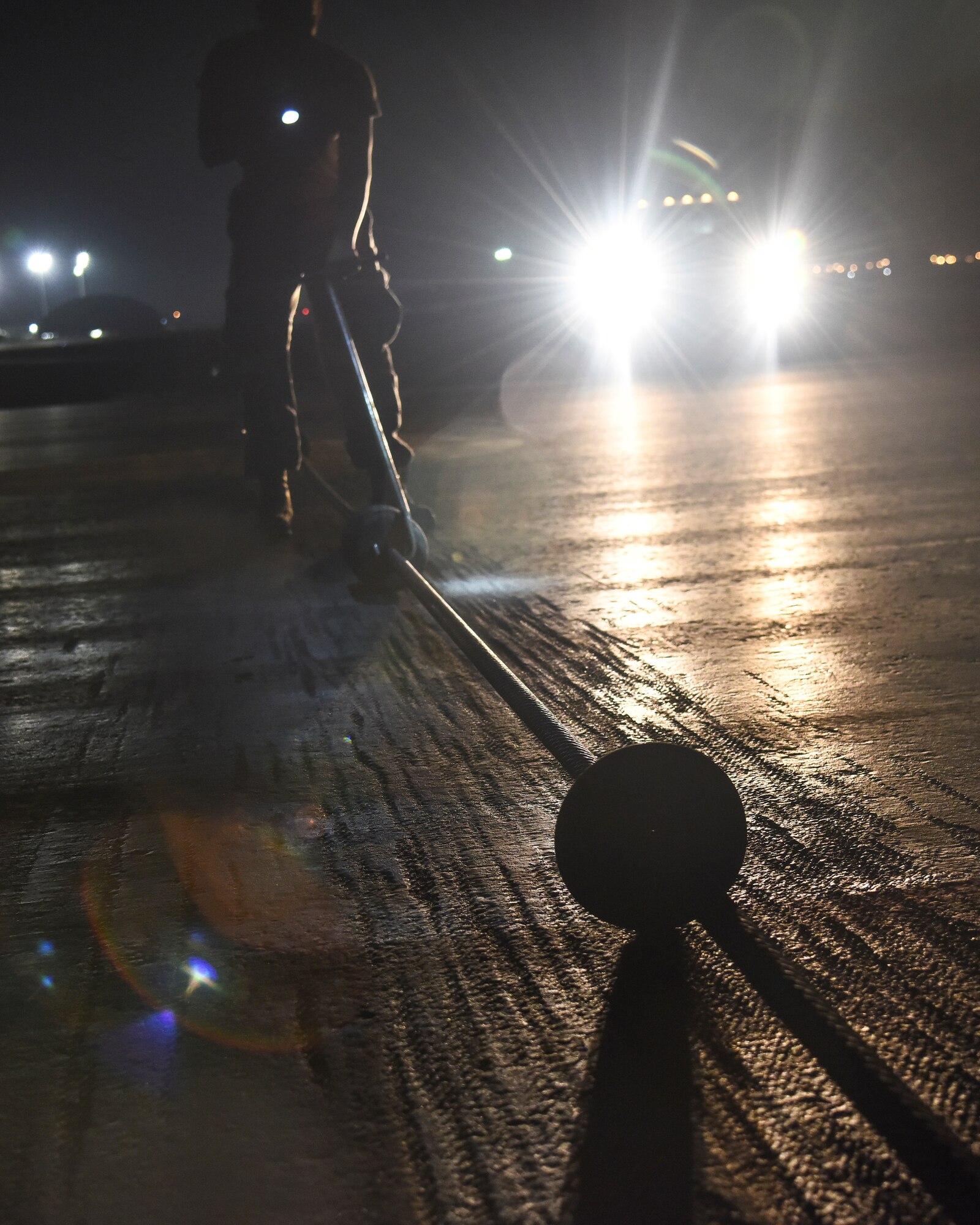 U.S. Air Force Senior Airman Jacob Cornelius, 380th Expeditionary Civil Engineer Squadron electrical power production and barrier maintenance journeyman, ensures precise spacing in between cable donuts of a BAK-12 Aircraft Arresting System at Al Dhafra Air Base, United Arab Emirates, Nov. 24, 2018. The Power Production barrier maintenance shop’s job centers on a 195-foot-long cable that assists in the case of a fighter jet in need of an emergency landing at ADAB. (U.S. Air Force photo by Senior Airman Mya M. Crosby)