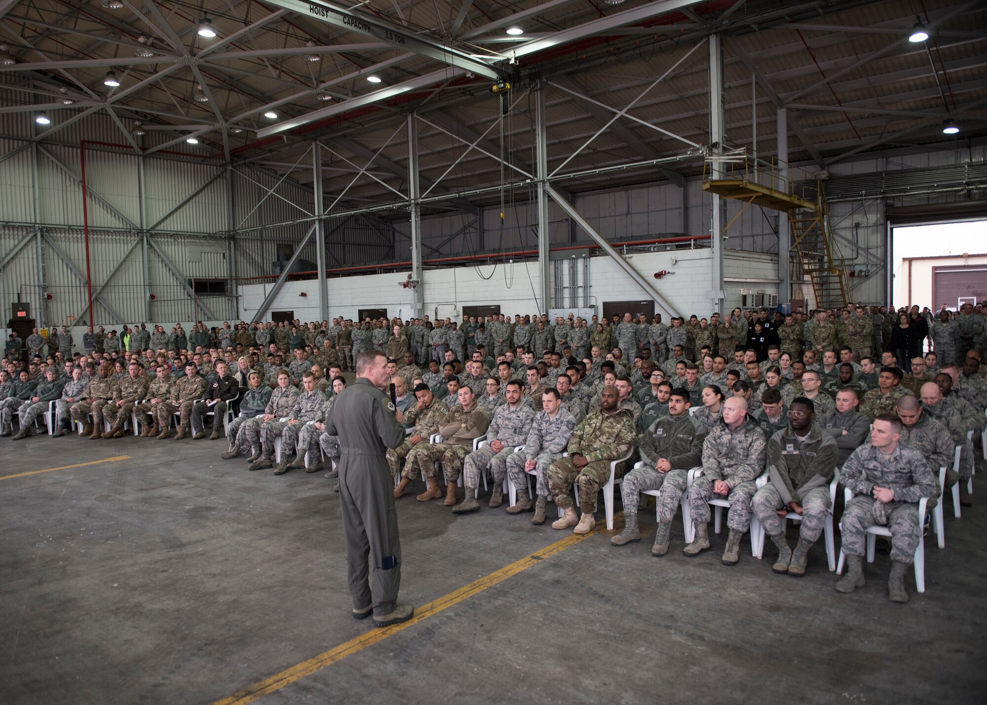 U.S service members listen to U.S. Air Force Gen. Tod D. Wolters during all-call briefing.
