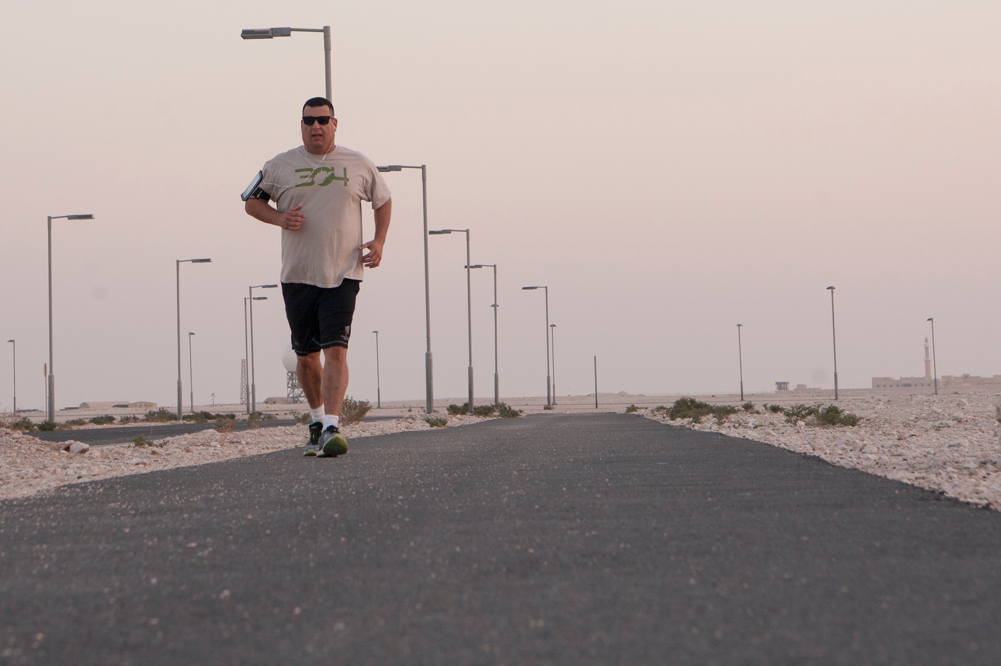 Chaplain (Maj.) Jack Miller, 379th Air Expeditionary Wing chapel office, runs the Blatchford-Preston Complex perimeter Dec. 6, 2018, at Al Udeid Air Base, Qatar. Miller was diagnosed with adrenal cancer in 2012 and told by doctors that he would never run longer distances again. While deployed at Al Udeid, Miller trained for months and was able to complete the base’s Veterans Day 5K run Nov. 11, 2018. (U.S. Air Force photo by Tech. Sgt. Christopher Hubenthal)