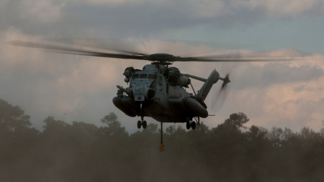 U.S. Marine Corps CH-53E Super Stallion aircraft assigned to Marine Heavy Helicopter Squadron 451 (HMH-451) conduct external lift operations during Exercise Northern Steel on Camp Lejeune, N.C., Dec. 5, 2018. The exercise combines elements of the Marine Air-Ground Task Force to build combined combat power, ensuring maximized readiness for potential global contingencies. (U.S. Marine Corps photo by Lance Cpl. Aaron Douds)
