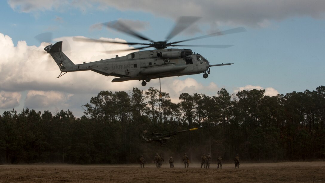 A U.S. Marine Corps CH-53E Super Stallion aircraft assigned to Marine Heavy Helicopter Squadron 451 conduct external lift operations during Exercise Northern Steel on Camp Lejeune, N.C., Dec. 5, 2018 The exercise uses multiple combative components in the division to enhance mission readiness. (U.S. Marine Corps photo by Lance Cpl. Aaron Douds)