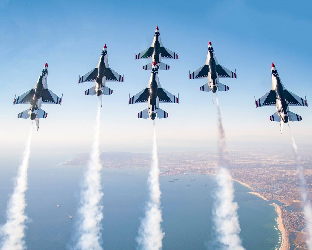 The U.S. Air Force's premier aerial demonstration team, the Thunderbirds, fly over Huntington Beach, California, during one of their performances in 2018. The Thunderbirds are scheduled to come to Grand Forks Air Force Base, North Dakota August 1 and 2, 2020 for a free public show. (Courtesy photo/ U.S. Air Force Thunderbirds)