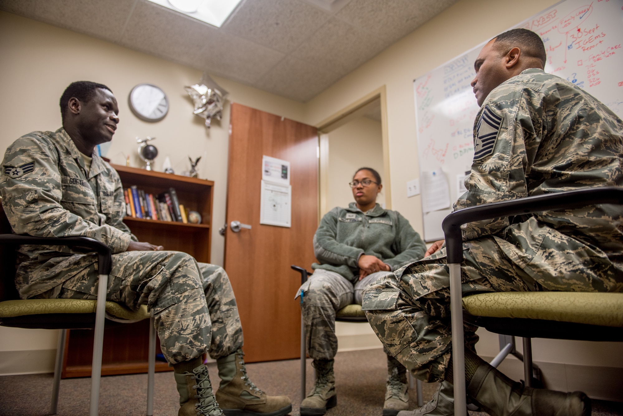 Chief Master Sgt. Anthony Harris, 512 Airlift Wing Force Support Squadron superintendent, holds a feedback session with Senior Airman Maboury Gueye and Staff Sgt. Tiffany McClammy, two FSS Airmen, at Dover Air Force Base Delaware, Nov. 24, 2018. Harris meets with lower ranking Airmen as a way to monitor service member morale. (U.S. Air Force photo by Staff Sgt. Damien Taylor)