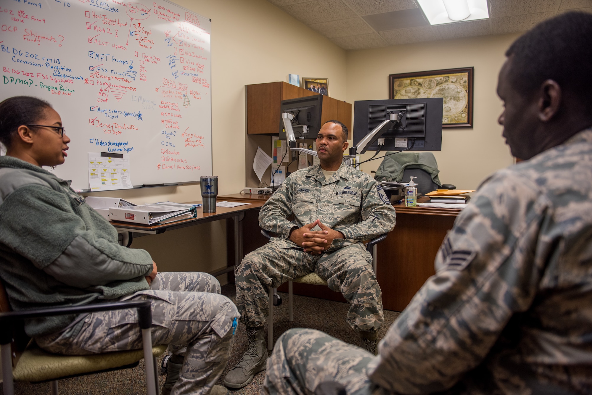 Chief Master Sgt. Anthony Harris, 512 Airlift Wing Force Support Squadron superintendent, holds a feedback session with Senior Airman Maboury Gueye and Staff Sgt. Tiffany McClammy, two FSS Airmen, at Dover Air Force Base Delaware, Nov. 24, 2018. Harris meets with lower ranking Airmen as a way to garner input for innovating wing processes. (U.S. Air Force photo by Staff Sgt. Damien Taylor)