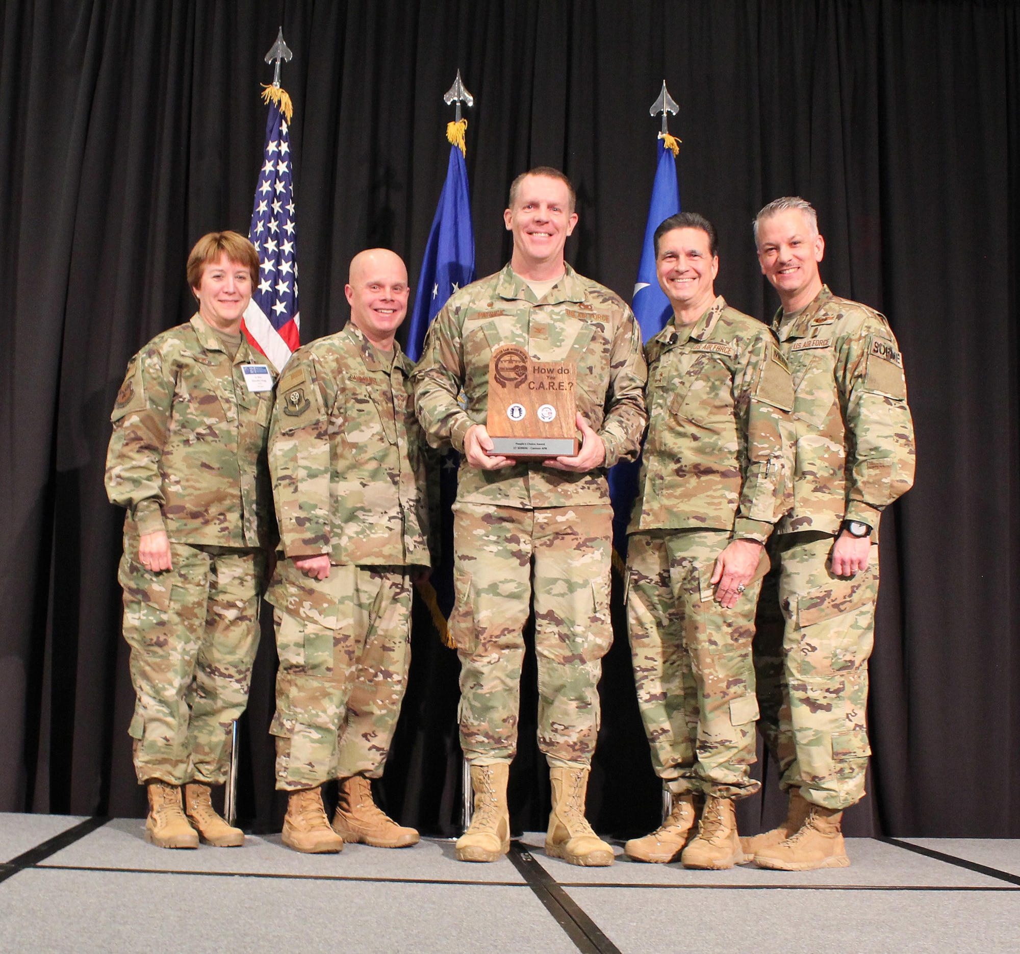 U.S Air Force Lt. Gen. Dorothy Hogg, Air Force Surgeon General, U.S. Air Force Maj. Gen. (Dr.) Sean L. Murphy, Deputy Surgeon General, and Chief Master Sgt. G. Steve Cum, Chief, Medical Enlisted Force and Enlisted Corps Chief, pose with U.S. Air Force Col. Christopher Patrick and Chief Master Sgt. Jason Dahlquist, Cannon Air Force Base, New Mexico, during the 2018 Air Force Medical Service Senior Leadership Workshop at the National Conference Center in Leesburg, Va., Dec. 5, 2018. Patrick and Dahlquist accepted the People’s Choice Award and Best Supporting Safety Coach Award for the Trusted Care “How Do You C.A.R.E.” campaign on behalf of Cristal Mitchell and Cannon AFB. (U.S. Air Force photo by Josh Mahler)