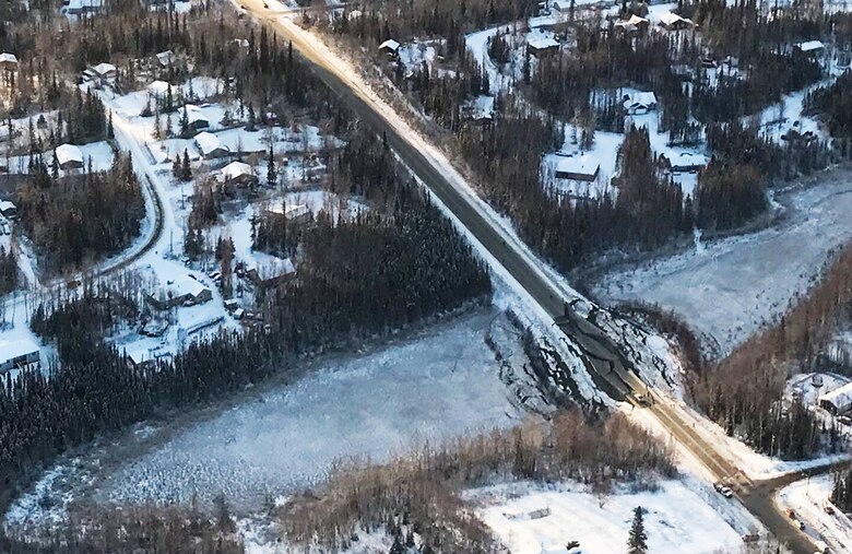 aerial damage assessment following an earthquake showing a broken roadway