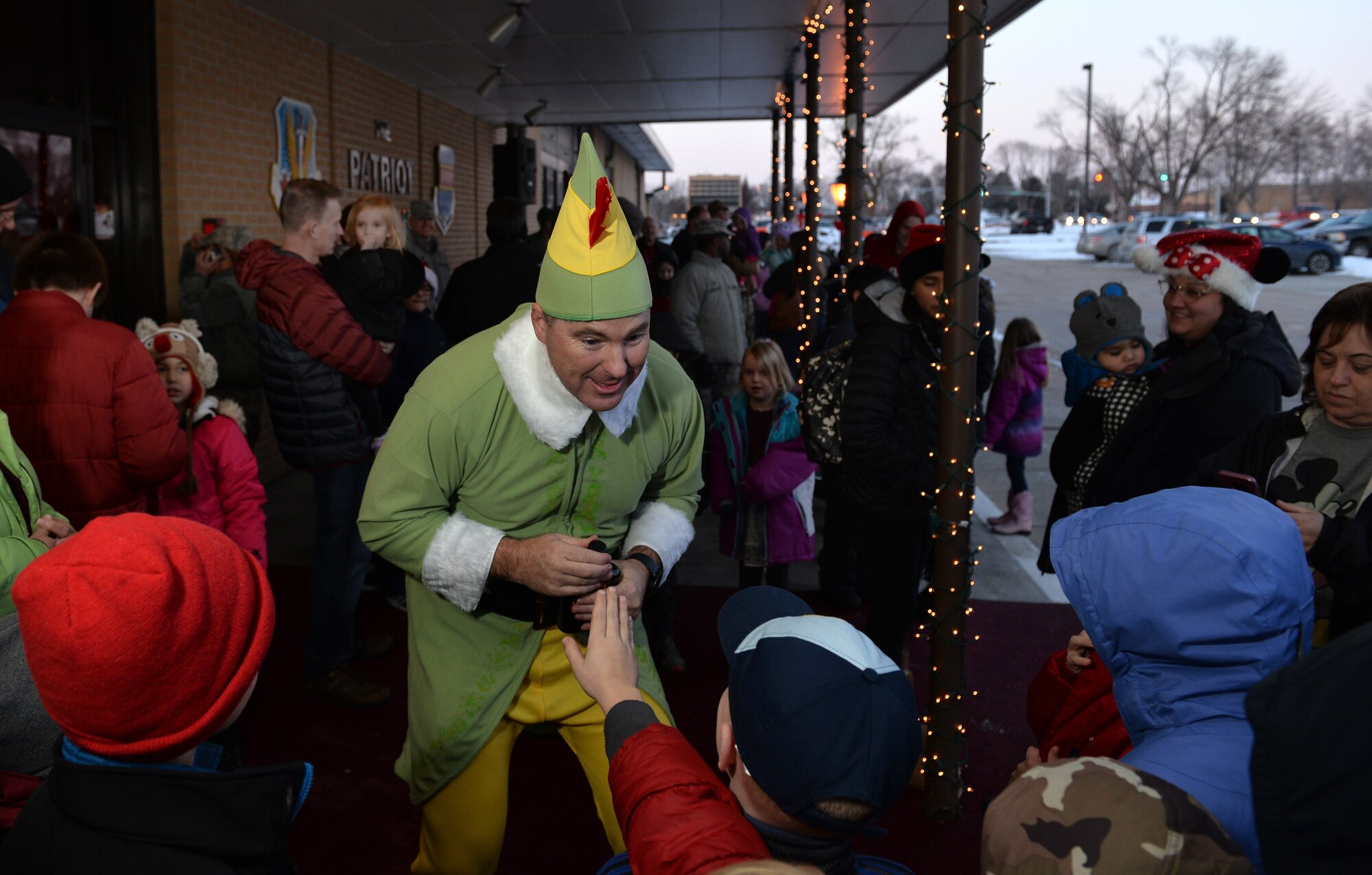 Senior Master Sgt. Charles Rose, 55th Wing Inspector General superintendent, entertains children as ‘Budd’ the elf during the annual Offutt Christmas Tree Lighting event held at the Patriot Club, Offutt Air Force Base, Nebraska, Dec. 6, 2018. Rose, along with being the festivities emcee, entertained guests throughout the club – always in character. (U.S. Air Force photo by Josh Plueger)