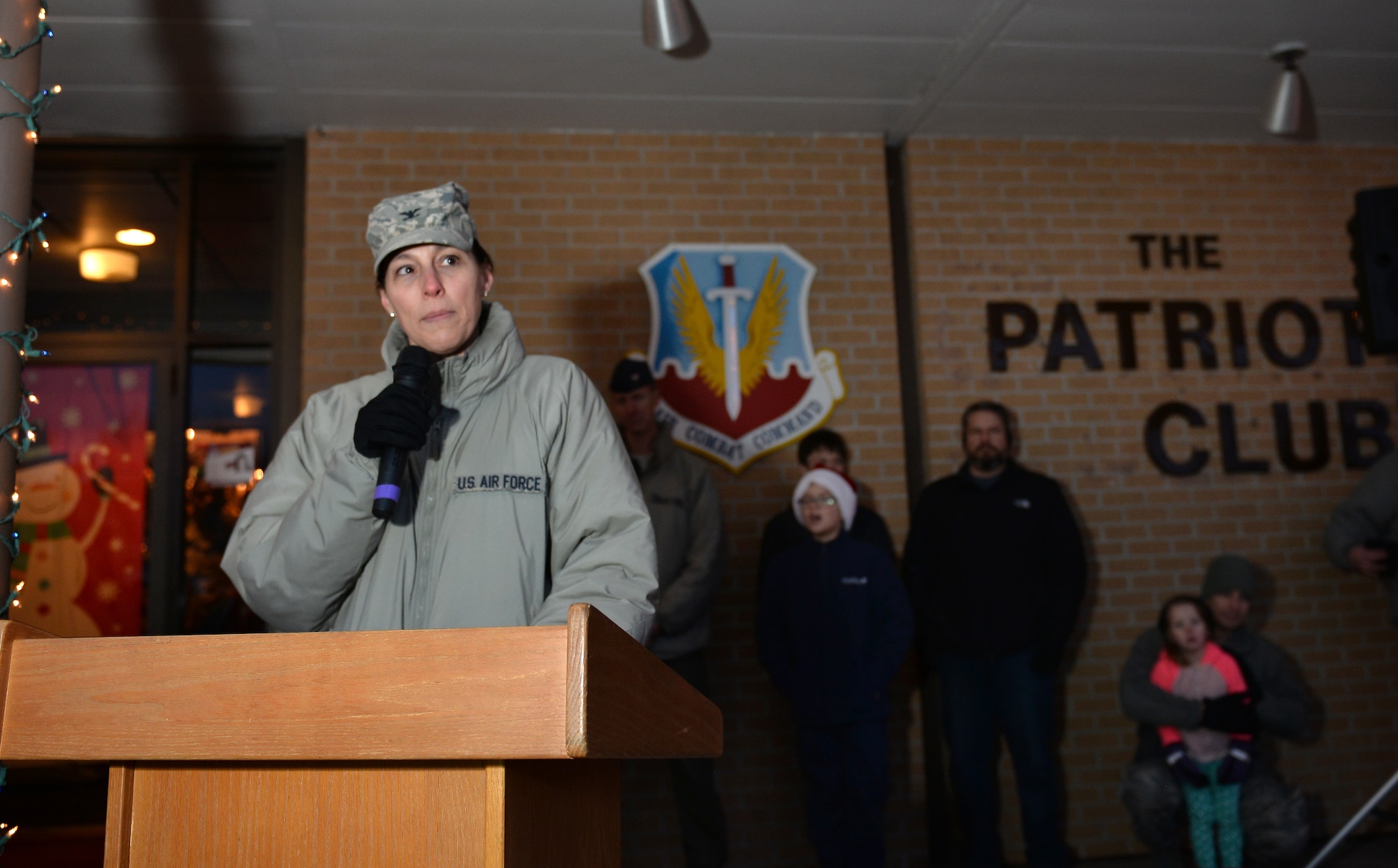 Colonel Sherri Levan, 55th Wing vice commander, greets the crowd during the annual Offutt Christmas Tree Lighting event held at the Patriot Club, Offutt Air Force Base, Nebraska, Dec. 6, 2018. The annual tree-lighting event was attended by an estimated 1,500 people. (U.S. Air Force photo by Josh Plueger)
