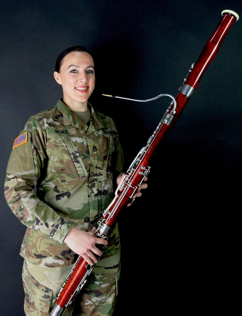 Indiana National Guard Staff Sgt. LeeAnn Boaz, an instrumentalist with the 38th Infantry Division Band, poses with her bassoon on March 10, 2018.