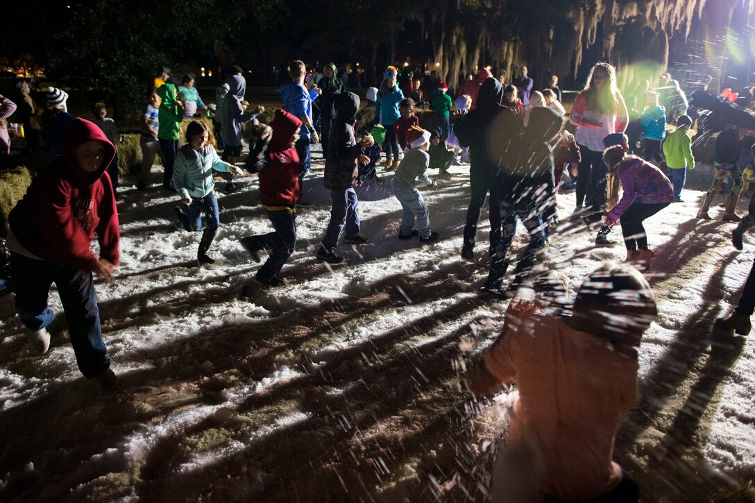 Children play in the snowball pit during the Tree Lighting Ceremony, Nov. 30, 2018, at Moody Air Force Base, Ga. The event continues the tradition of families of deployed Airmen lighting the base Christmas tree. As a way to celebrate the sacrifices of Team Moody Airmen and their families, the base also hosted a parade and other holiday festivities. (U.S. Air Force photo by Airman 1st Class Erick Requadt)