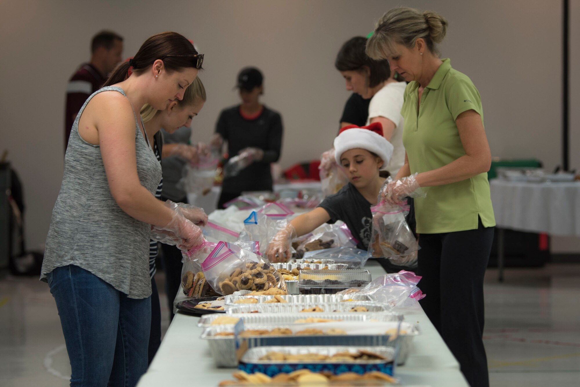 Participants package cookies during the Annual Moody Airmen Cookie Drive, Dec. 3, 2018, at Moody Air Force Base, Ga. The cookie drive produced over 100 bags of cookies to show appreciation for the Airmen across base during the holidays. (U.S. Air Force photo by Airman Taryn Butler)