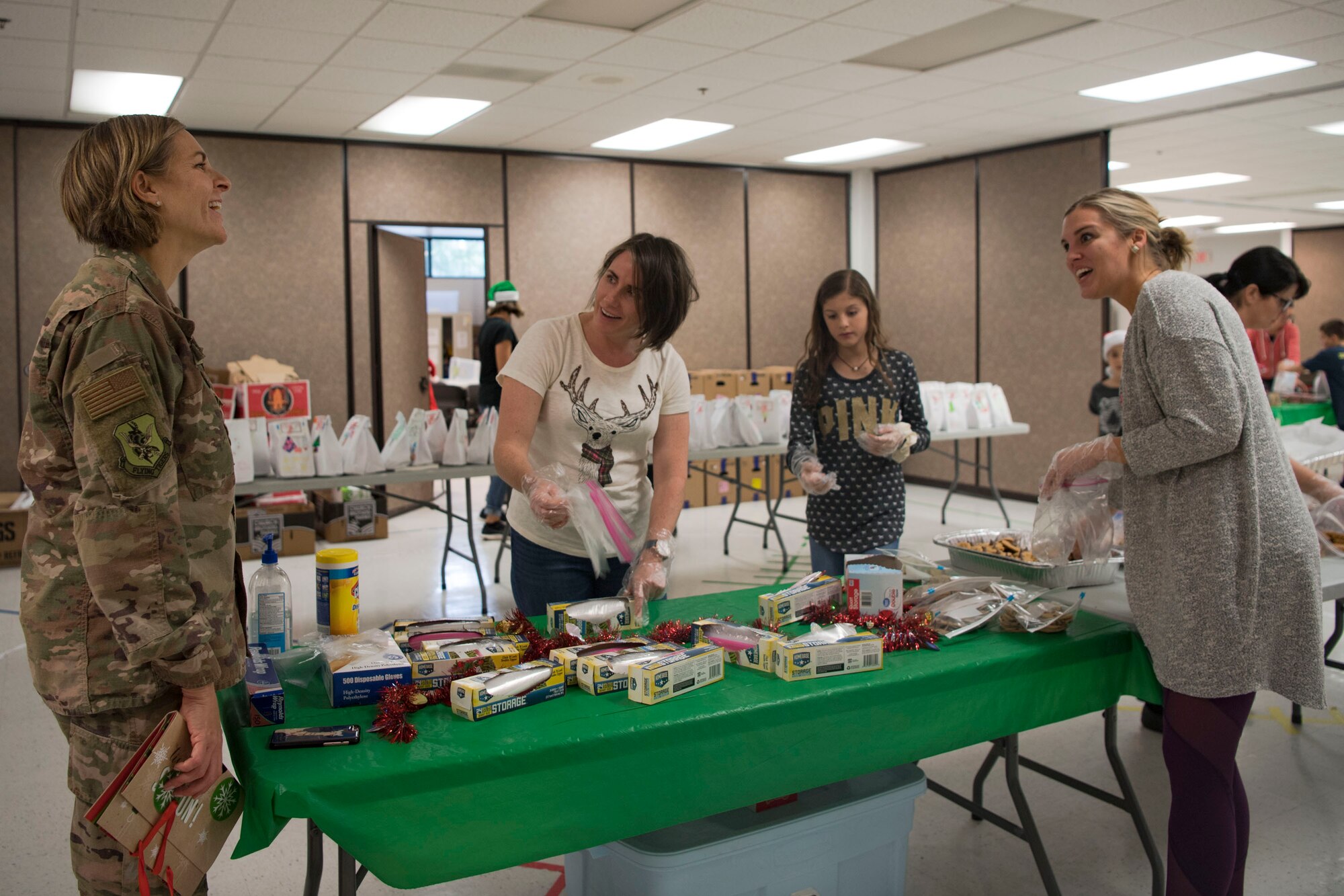 Col. Jennifer Short, 23d Wing commander, left, talks with participants during the Annual Moody Airmen Cookie Drive, Dec. 3, 2018, at Moody Air Force Base, Ga. The cookie drive produced over 100 bags of cookies to show appreciation for the Airmen across base during the holidays. (U.S. Air Force photo by Airman Taryn Butler)