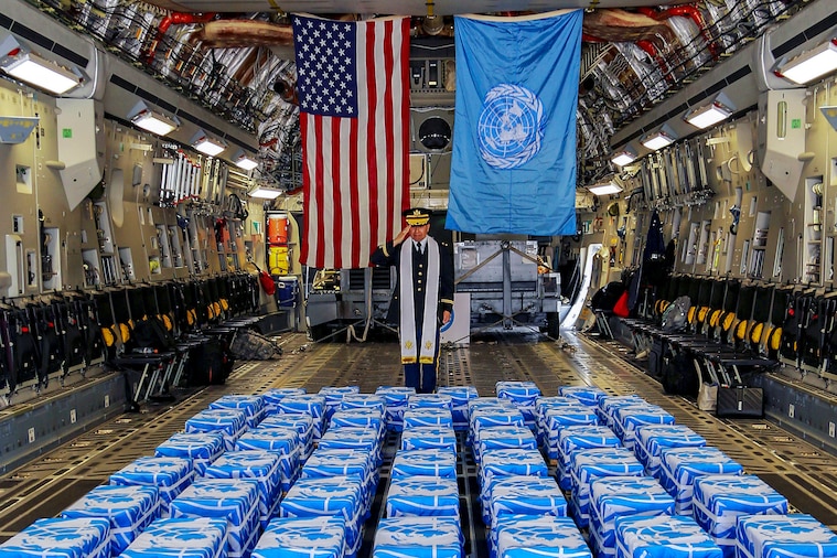 United Nations Command Chaplain Army Col. Sam Lee performs a blessing of sacrifice and remembrance on the 55 cases of remains.