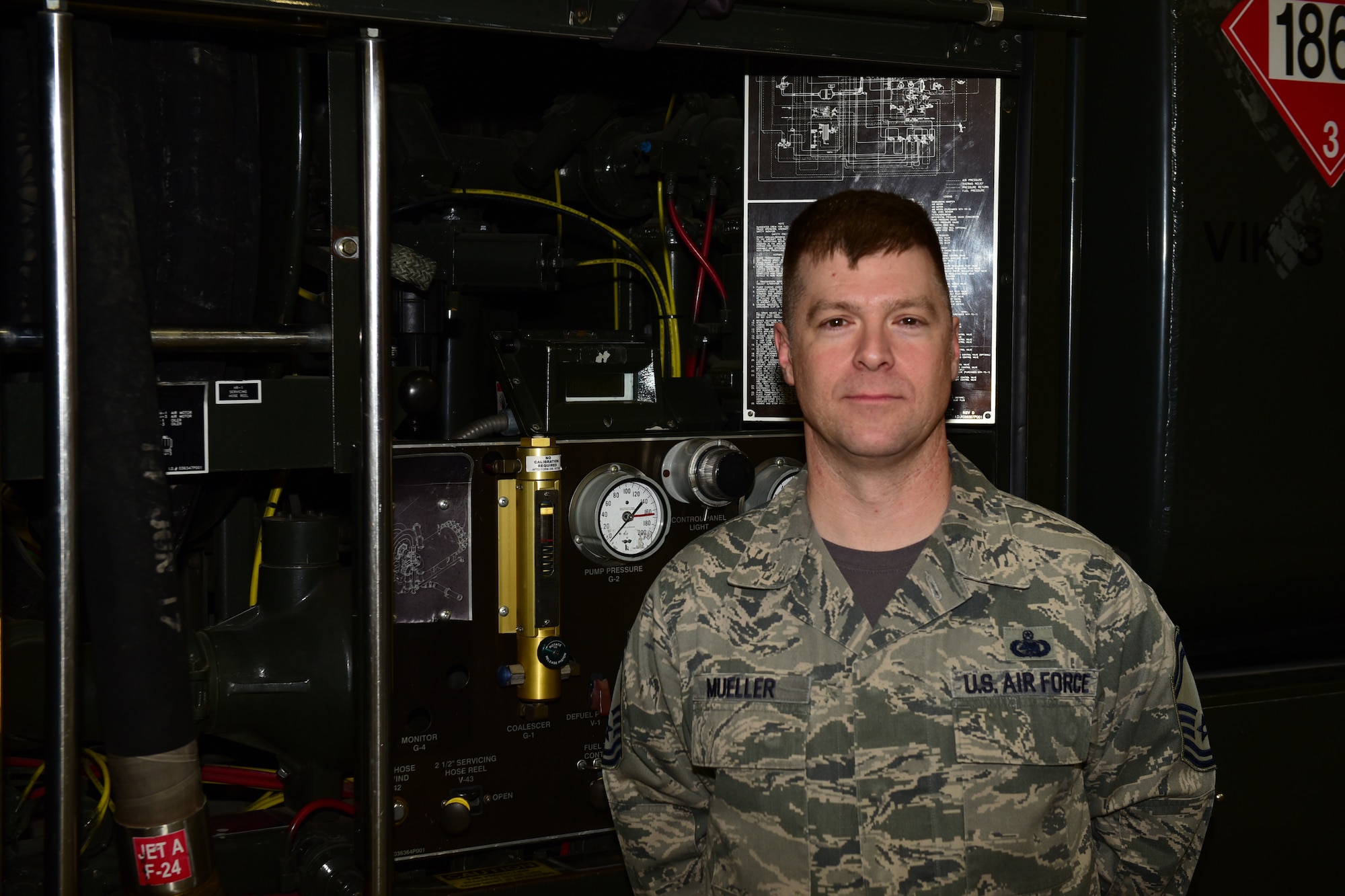 Senior Master Sgt. Edward Mueller, the 28th Logistics Readiness Squadron fuels management flight superintendent, stands in front of a fuel reloading truck. Mueller was the winner of the General Lew Allen, Jr., Trophy, presented in recognition of the efforts of logistics readiness officers and noncommissioned officers throughout the Air Force. (U.S. Air Force photo by 2nd Lt. Joshua Sinclair)