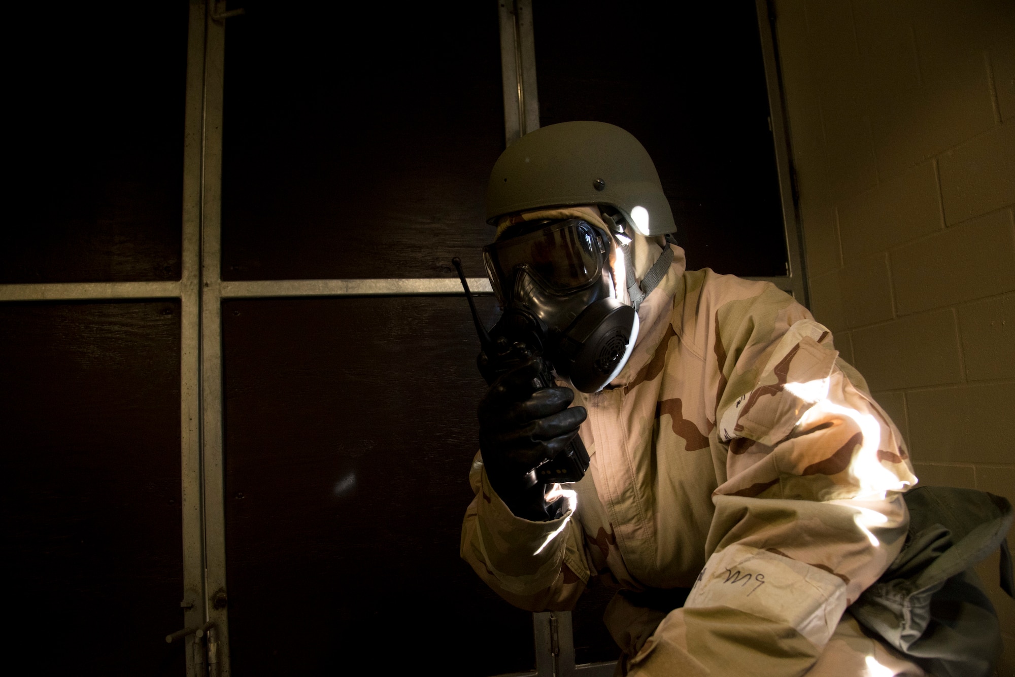 U.S. Air Force Tech. Sgt. Larry Prince Jr, the 6th Force Support Squadron NCO in charge of lodging,
practices command and control on the radio after a simulated chemical attack during an Ability to
Survive and Operate training exercise at MacDill Air Force Base, Fla., Dec. 6, 2018. ATSO training
refreshes skills necessary for Airmen to accomplish their mission in austere conditions.