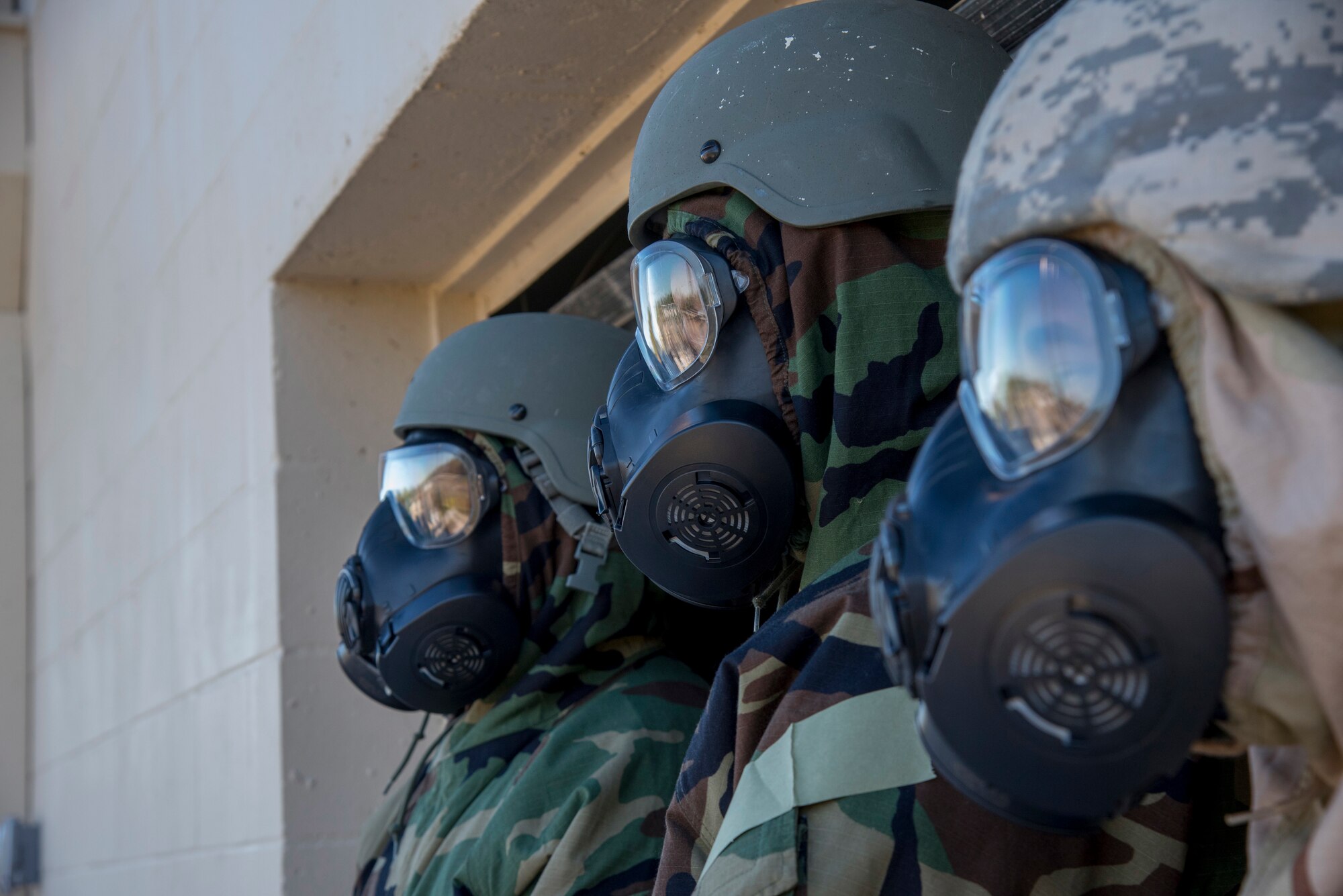 6th Mission Support Group Airmen don mission-oriented personal protective gear during an Ability to
Survive and Operate training exercise at MacDill, Air Force Base, Fla., Dec. 6, 2018. This equipment
protects the Airmen and allows them to continue operations and provide security in the event of a
chemical attack.