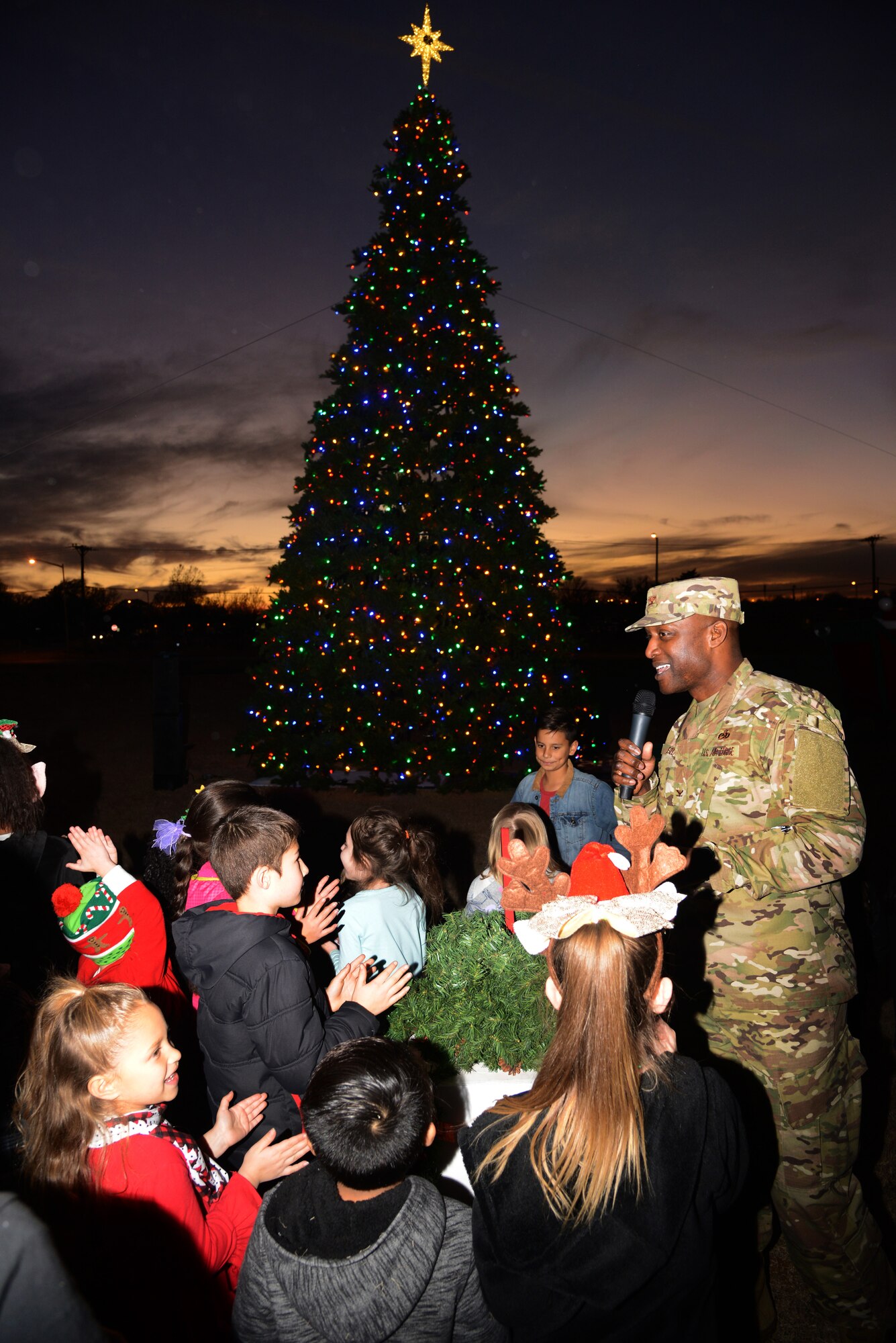 Tinker welcomed the holidays with their annual parade, tree lighting and celebration at the Tinker Club Nov. 28. The 72nd Force Support Squadron hosted Tinker families at the Tinker Club with a magical candy bar, face painting, photos with Santa and holiday dancing from children in Youth Center programs. 72nd Air Base Wing Commander Col. Kenyon Bell welcomed the families and encouraged everyone to believe in the spirit of the season and, with assistance from a handful of willing participants, lit the brand new tree in front of the Club.